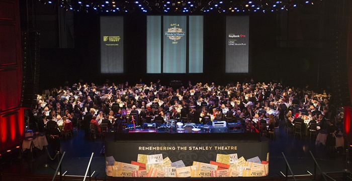 a large crowd of people on stage at the benedum center during a gala