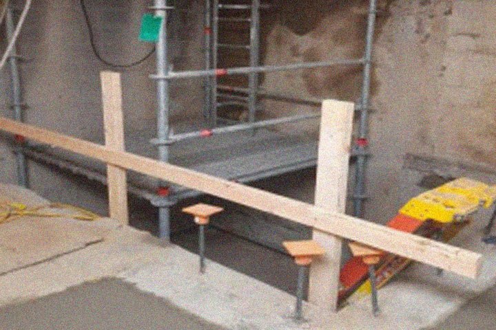 Scaffolding and concrete form the base of the new elevator.