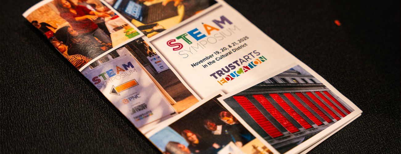  A close up of the STEAM Symposium program.