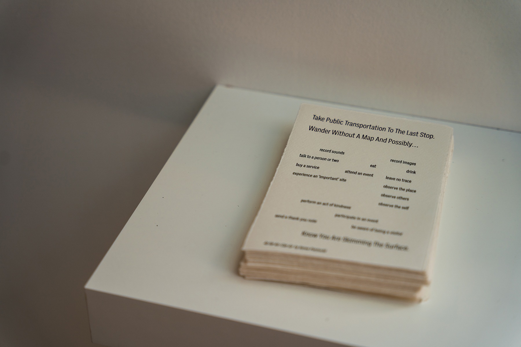 a detail shot of a stack of small cards with poems printed on them.