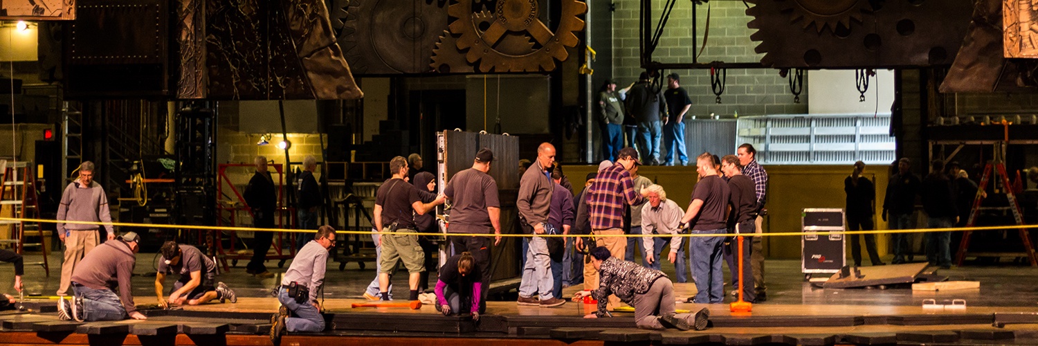 stagehands assembling the wicked set on the benedum center's stage