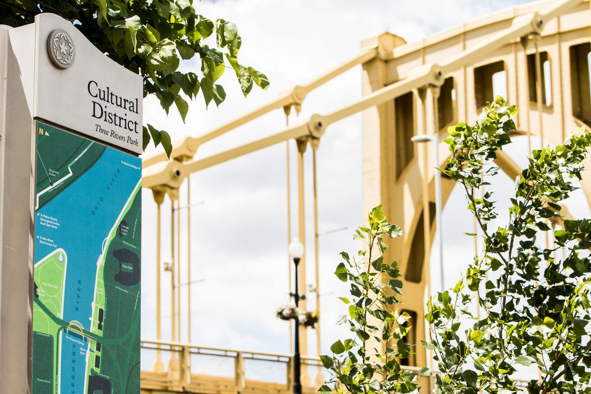 Pittsburgh's iconic yellow bridge with a Cultural District sign