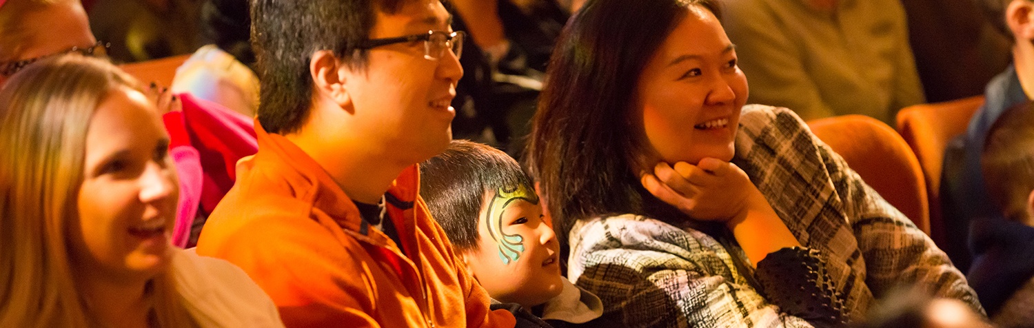 Dad, mom, and son enjoy a show at the EQT Children's Theater Festival
