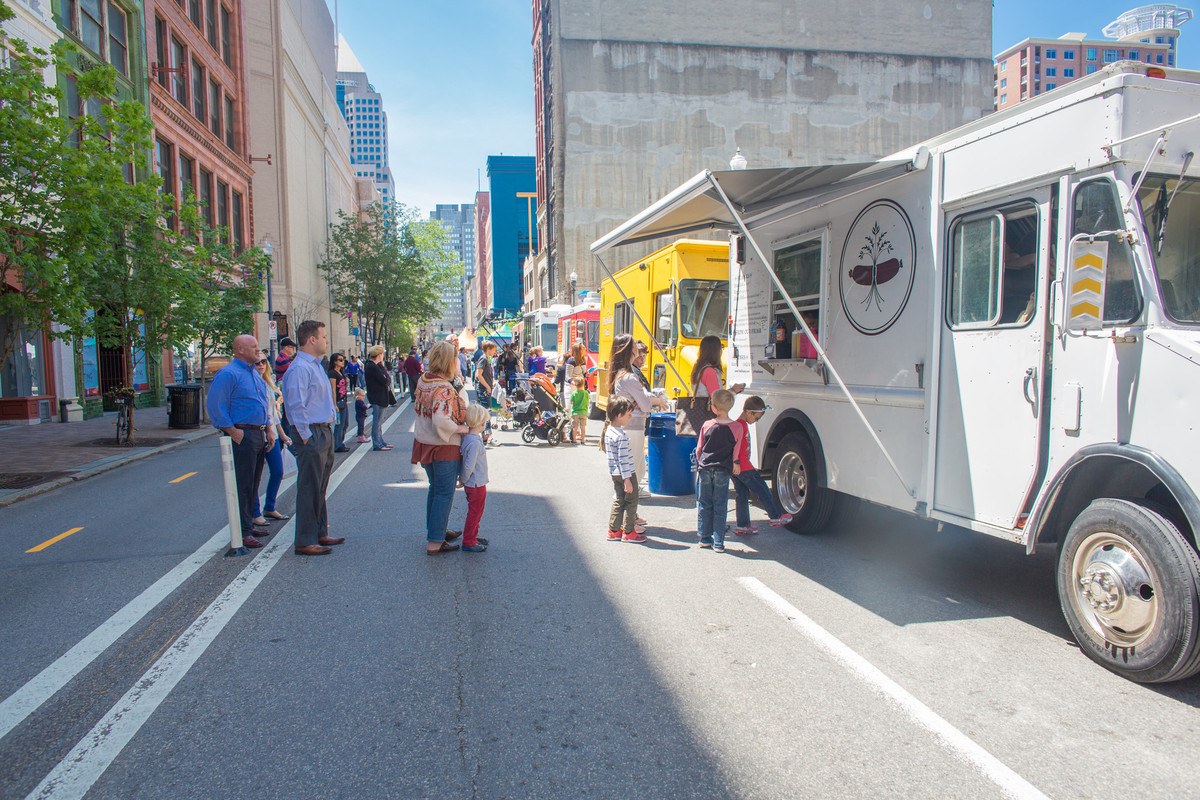 families line up outside of food truck in the Cultural District