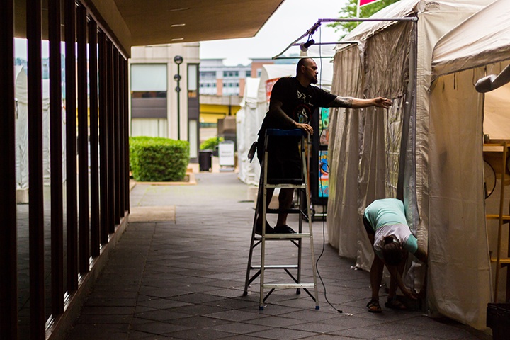 an artist finalizing their booth