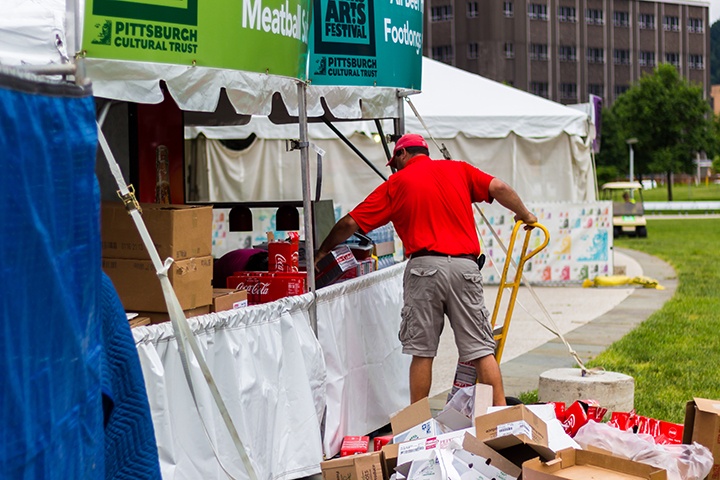 a food vendor setting up their tent