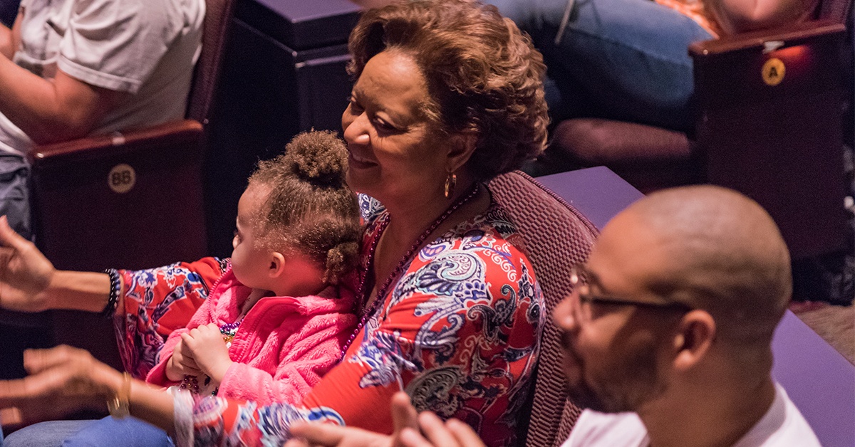 Mother and daughter enjoy a show