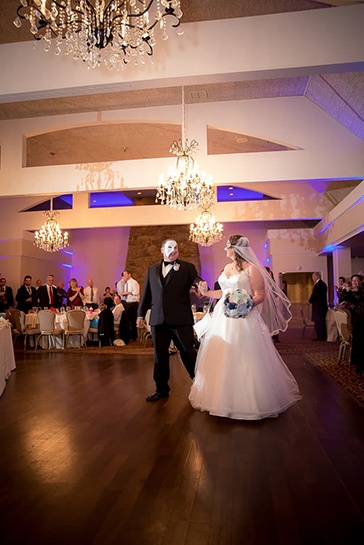 steve and maureen dance at their reception in phantom of the opera style masks