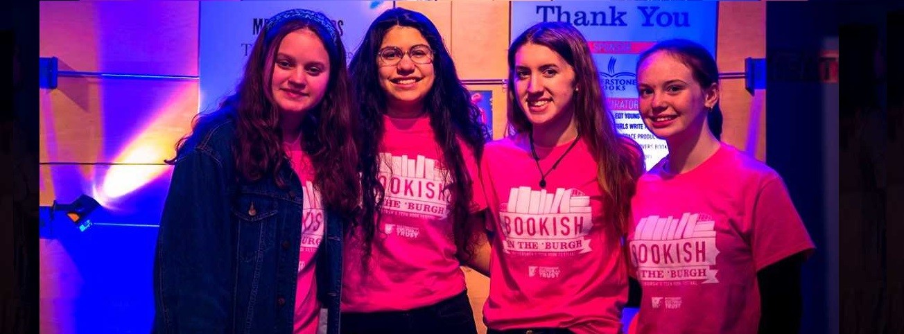 four teen ambassadors clad in bright pink t-shirts at Bookish in the 'Burgh
