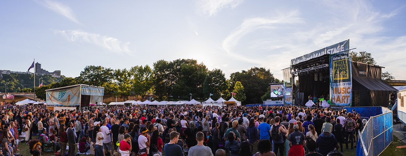 a large crowd fills point state park during a concert at the 2019 dollar bank three rivers arts festival.