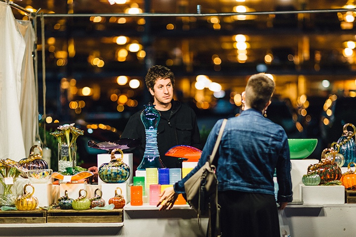 a photo of a vendor interacting with a customer