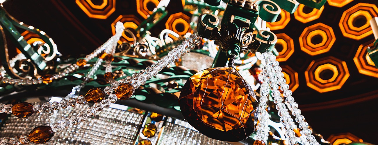 close-up shot of the Benedum Center's Grand Chandelier, its crystals and amber teardrop pendants