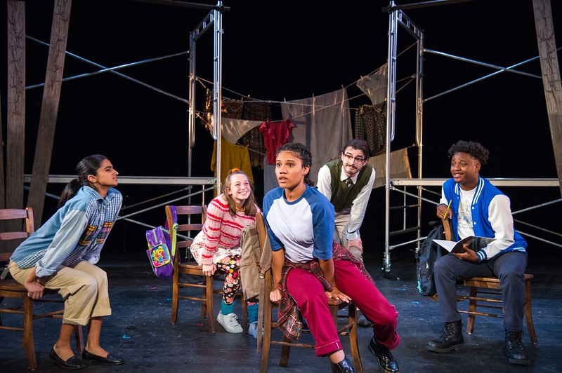 young girl sits in a circle of her peers in Walk Two Moons