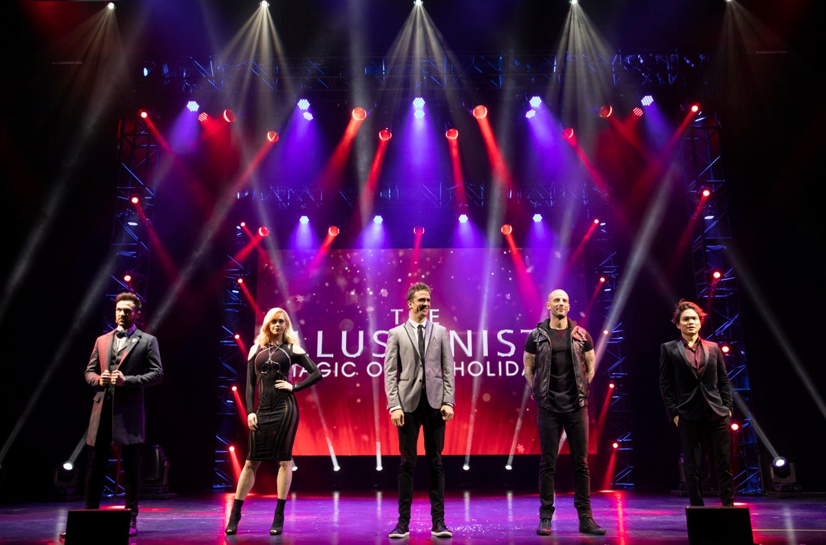 photo of five Illusionists magicians
