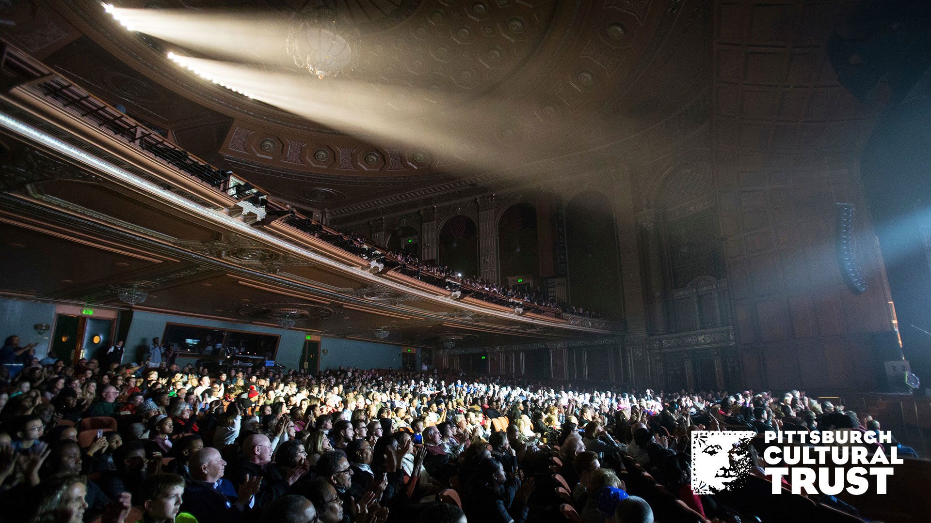a zoom background of a packed benedum center auditorium