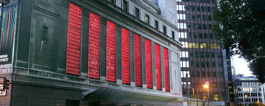 bright red columns of led lights on the exterior side of wood street galleries