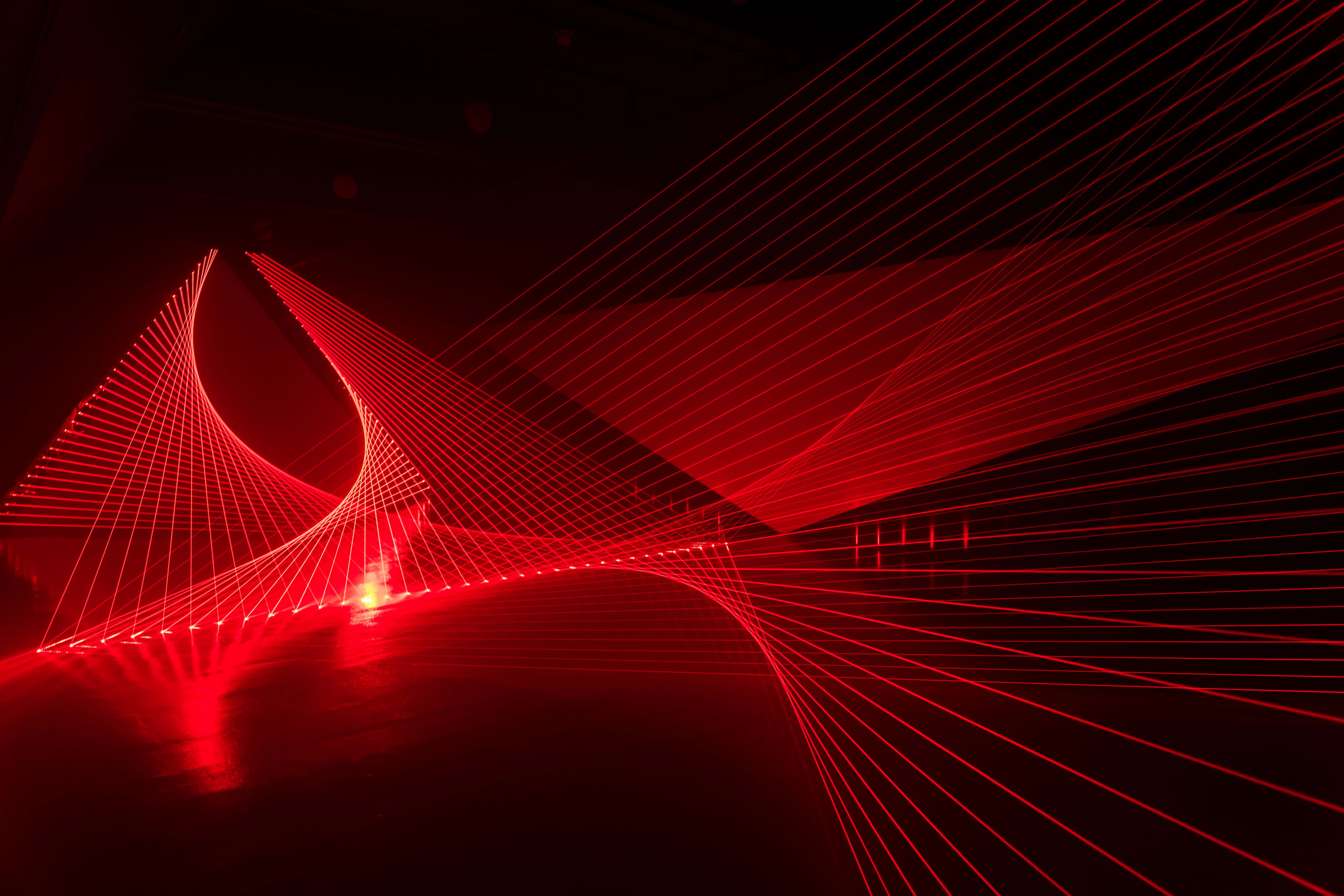  A wide view of Double Gemini from the side. Dozens of red lasers fan out in a specific way that creates smooth curves