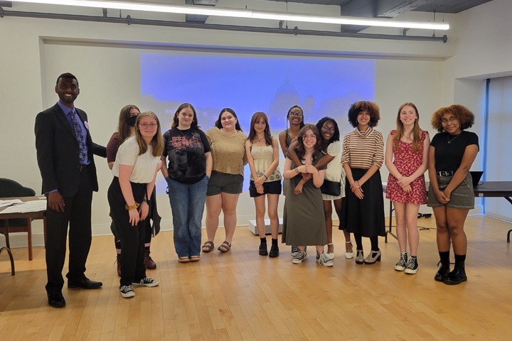  Vinay Thomas, far left, poses with students at the Beyond the Stage Award Ceremony.
