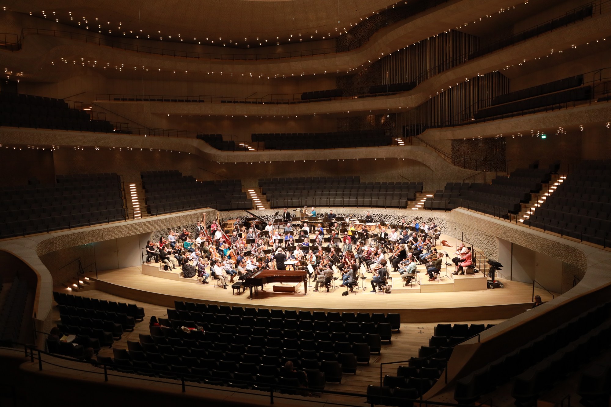 orchestra in dramatic lit room