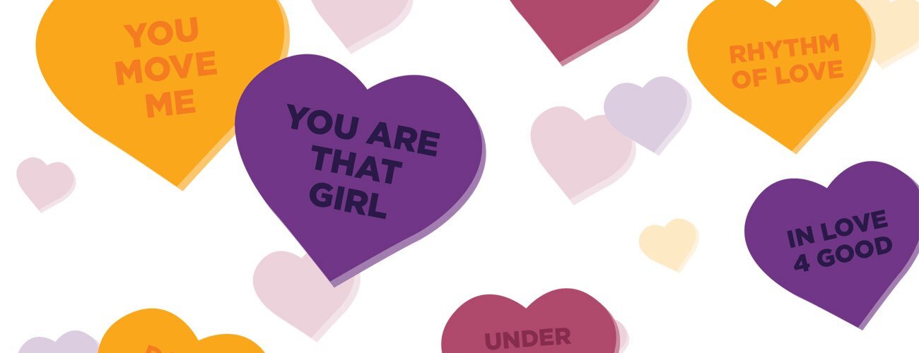 Glinda in a pink ball gown and Elphaba and in black dress and witches sit with one another.