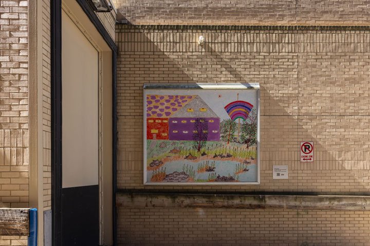 Colorful billboard with rainbows and a river scene is displayed in an alleyway with yellow brick walls.